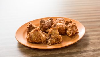 High Angle View Of Fried Chicken In Plate On Table