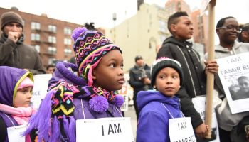 Kids with Tamir Rice signs. Stop Mass Incarcerations Network...