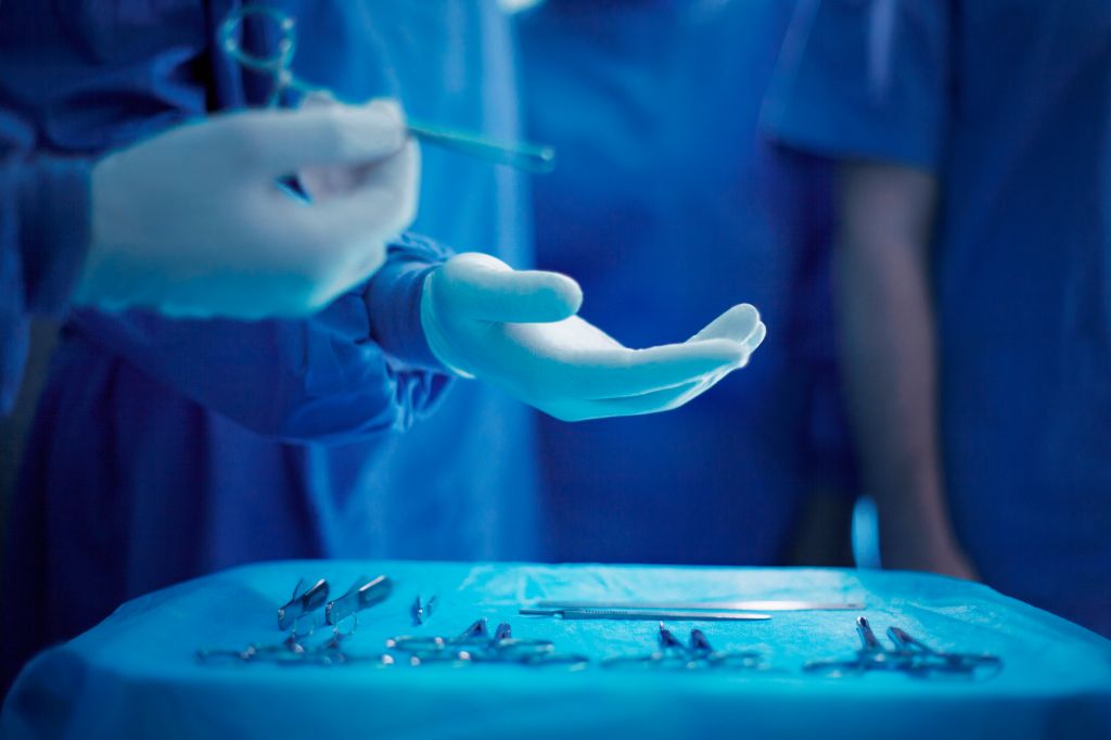 Handing doctor surgical tool in operating room