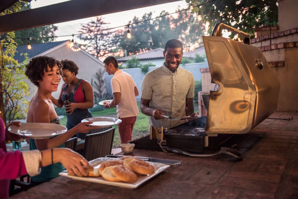 Hipsters Grilling at a Summer Backyard BBQ