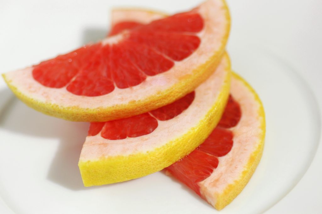 Close-up of slices of grapefruit in plate