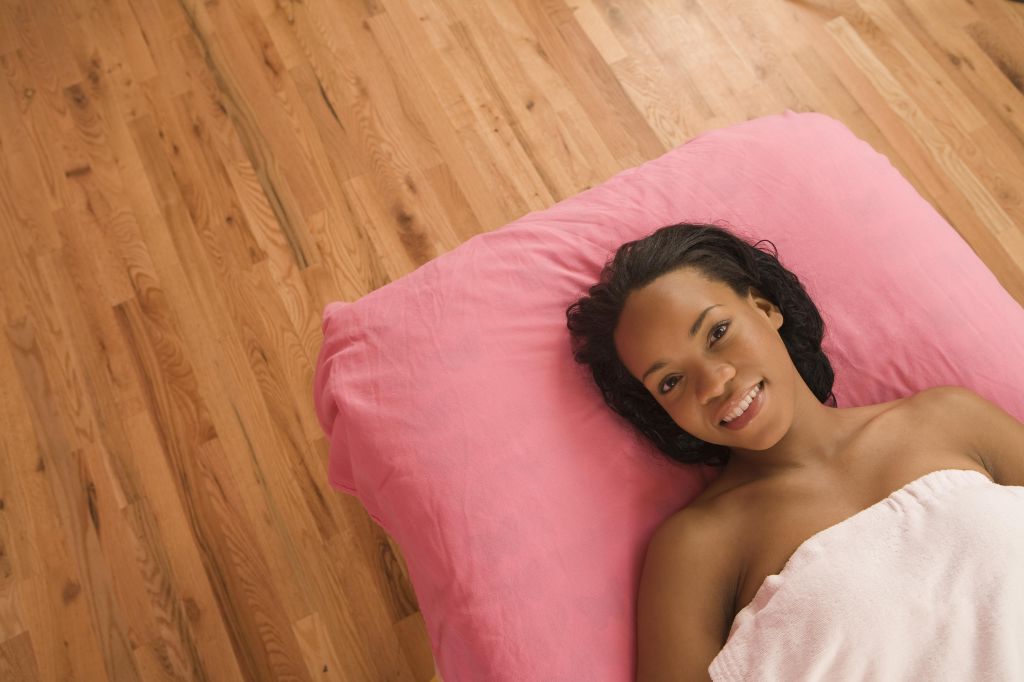 African American woman laying on massage table