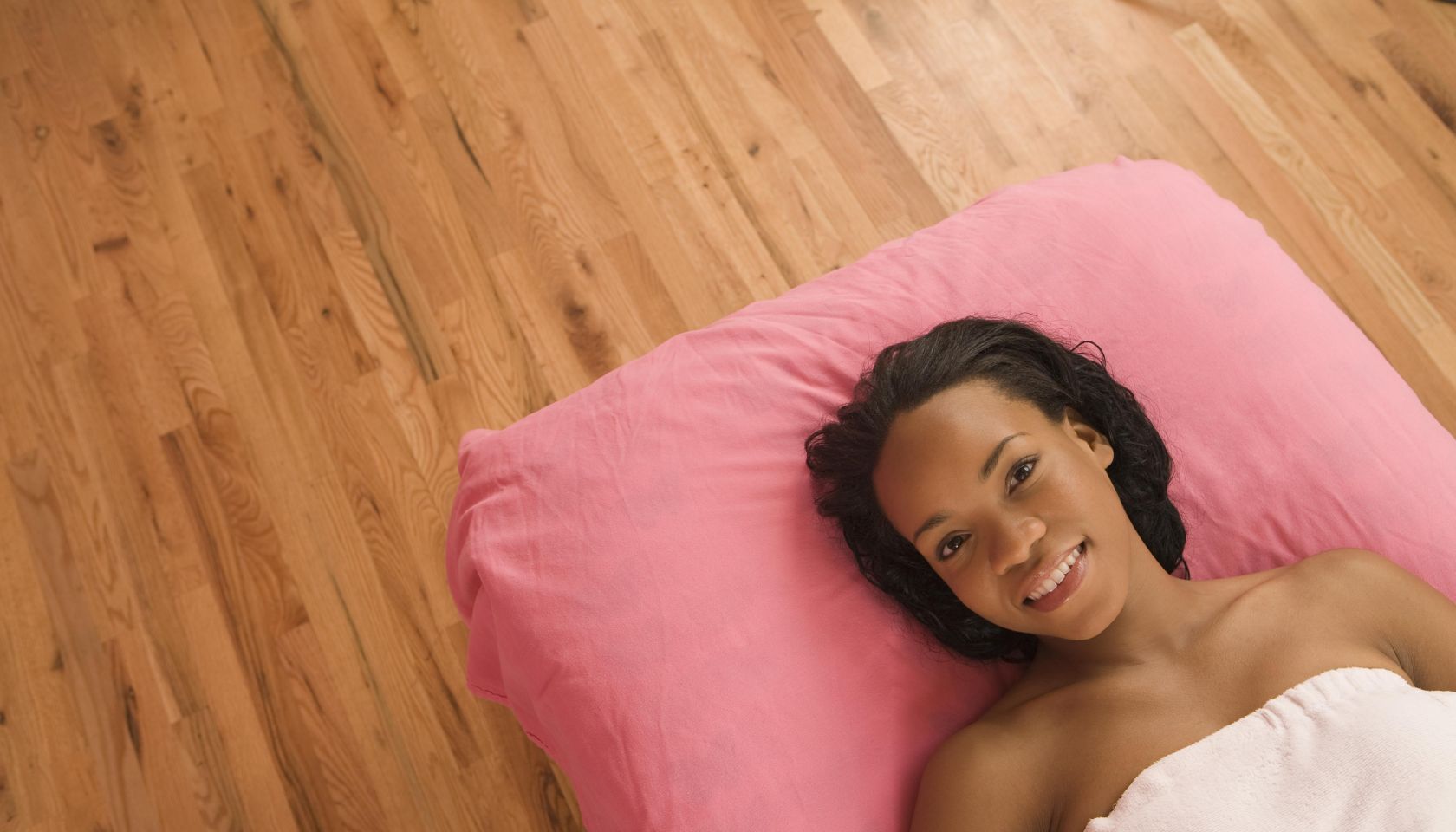 African American woman laying on massage table
