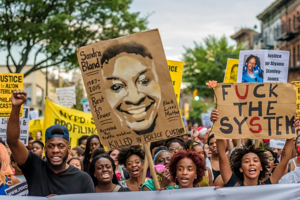 About a thousand Black Lives Matter activists rally at the...