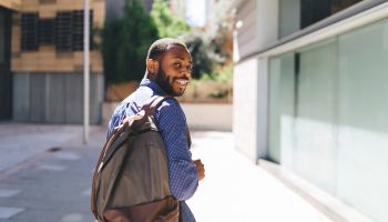 Smiling man with backpack