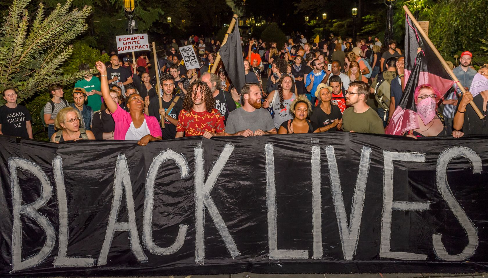 The families of victims of police brutality, community...
