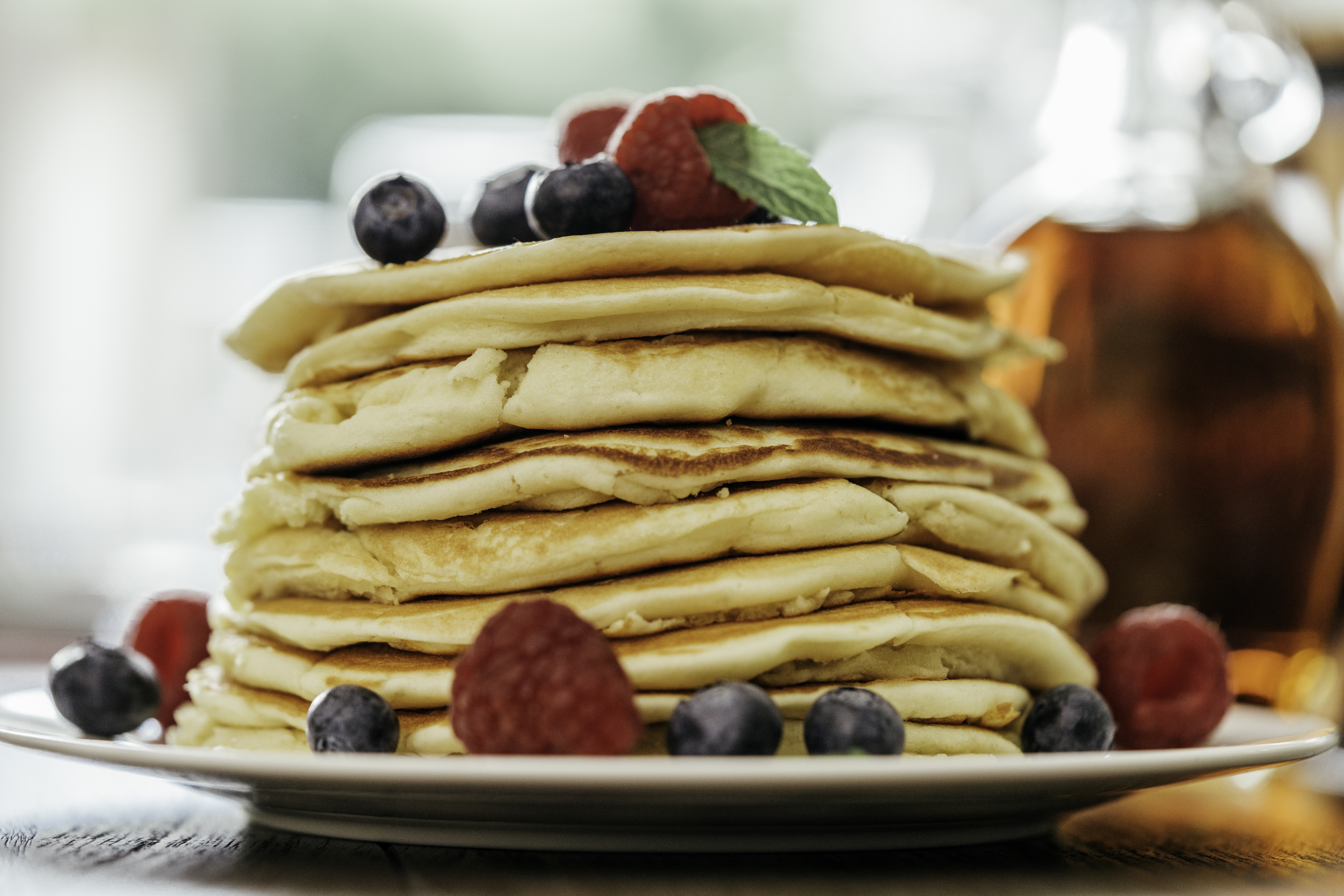 Stack of Pancakes with Maple Syrup and Fresh Berries