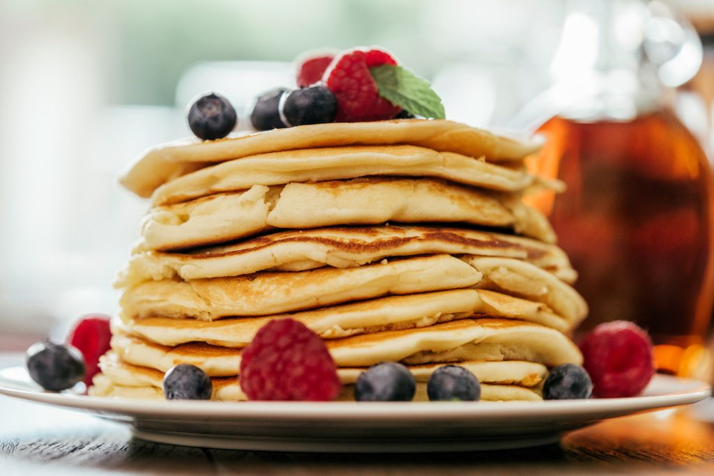 Stack of Pancakes with Maple Syrup and Fresh Berries
