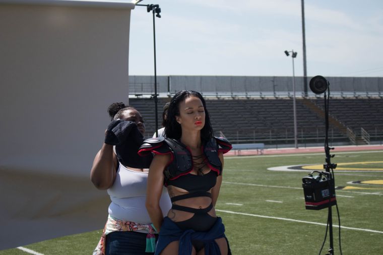Draya's cover look was completed with official football gear: Riddell shoulder pads and a Schutt helmet