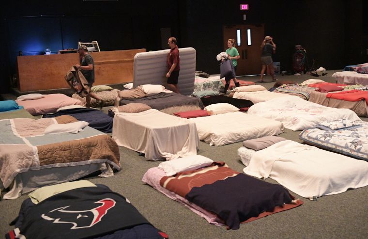 Volunteers set up a temporary shelter for those who've had to evacuate their homes.