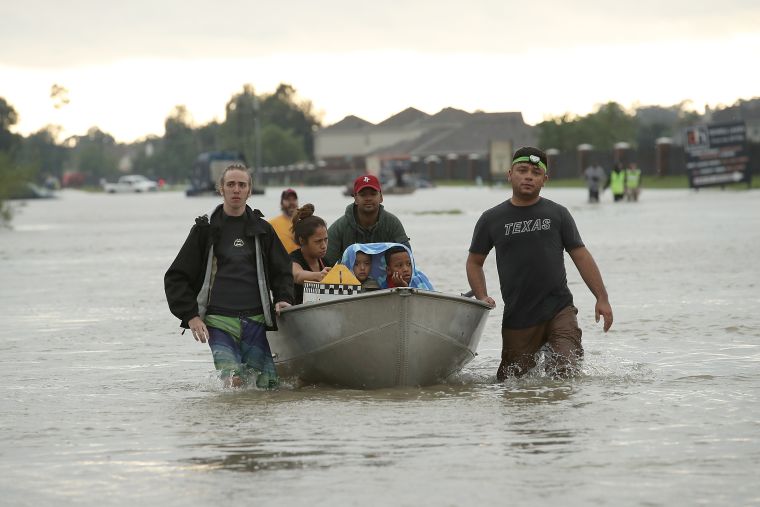 The Tellez family evacuates their home.