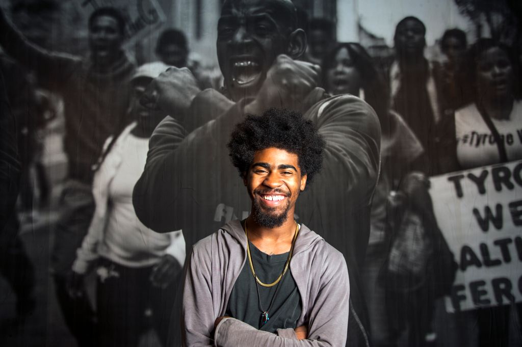 Devin Allen, amateur photographer whose photo of the Baltimore riots ended up on the cover of Time sets up a show at the Reginald Lewis Museum