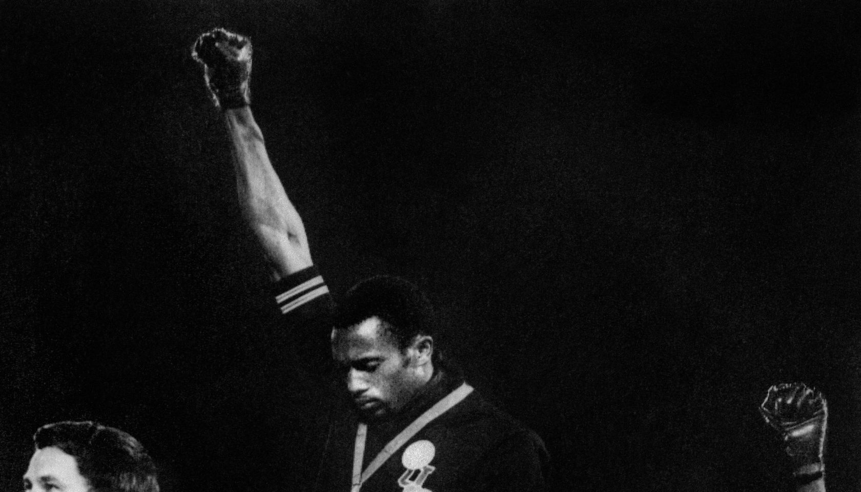 US athletes Tommie Smith (C) and John Ca