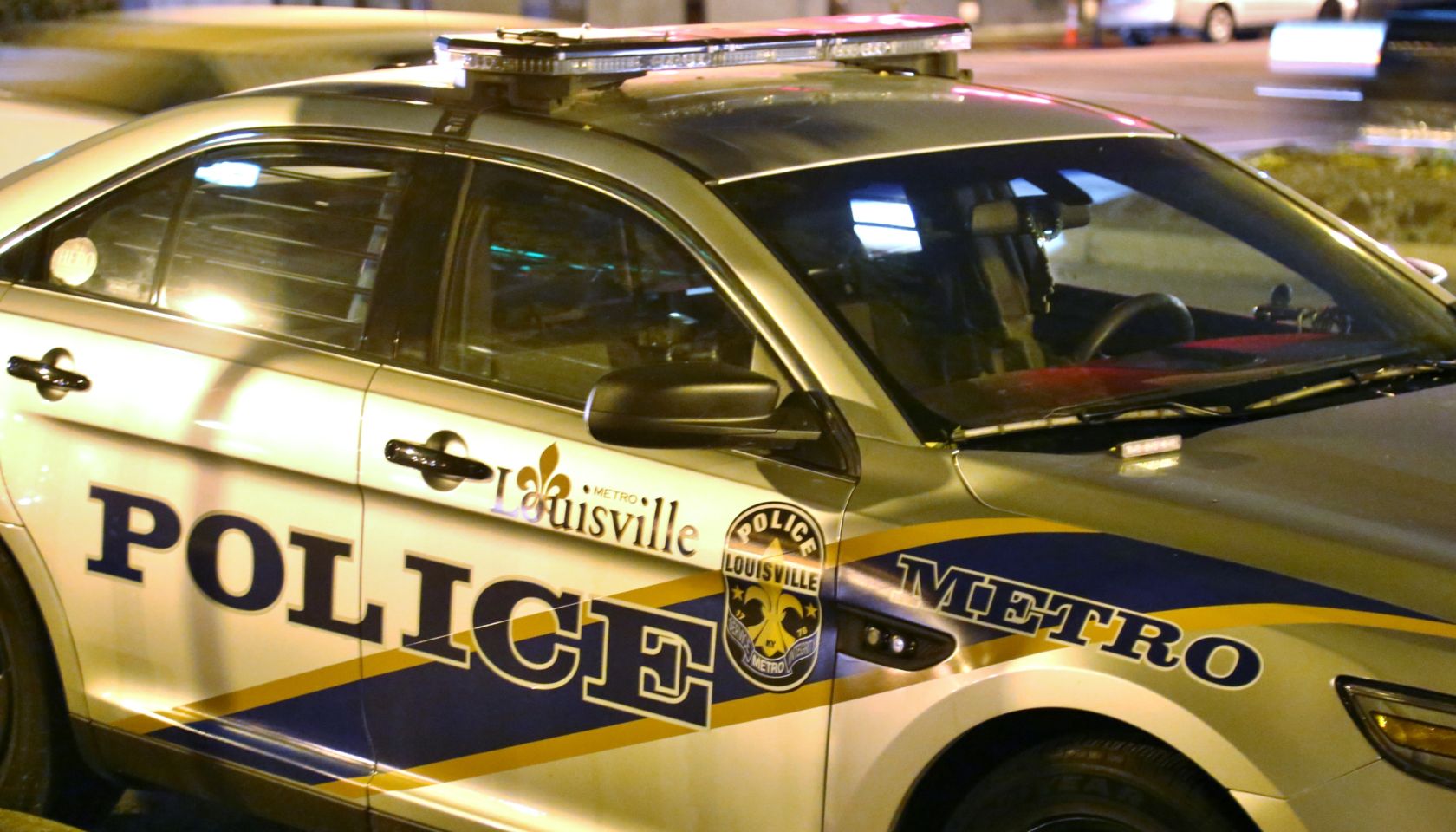 Full frame of a Police car with flashing lights
