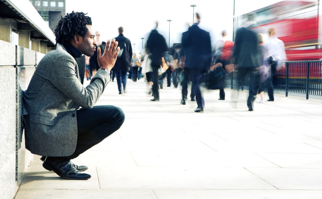 Contemplation from a solitary character contrasting against a hurried world