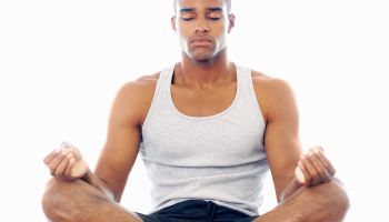 A man meditating in lotus position