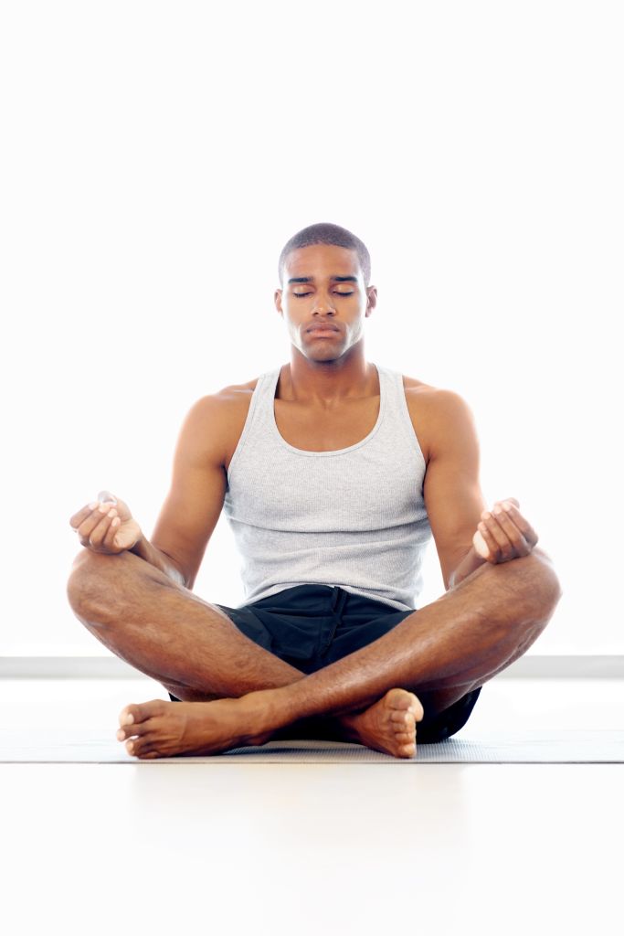 A man meditating in lotus position