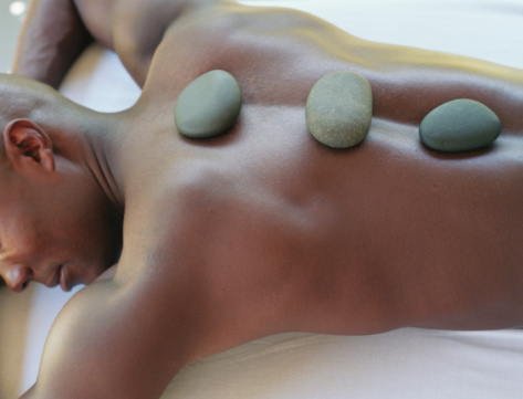 Getty Images- Young man receiving lastone therapy, elevated view