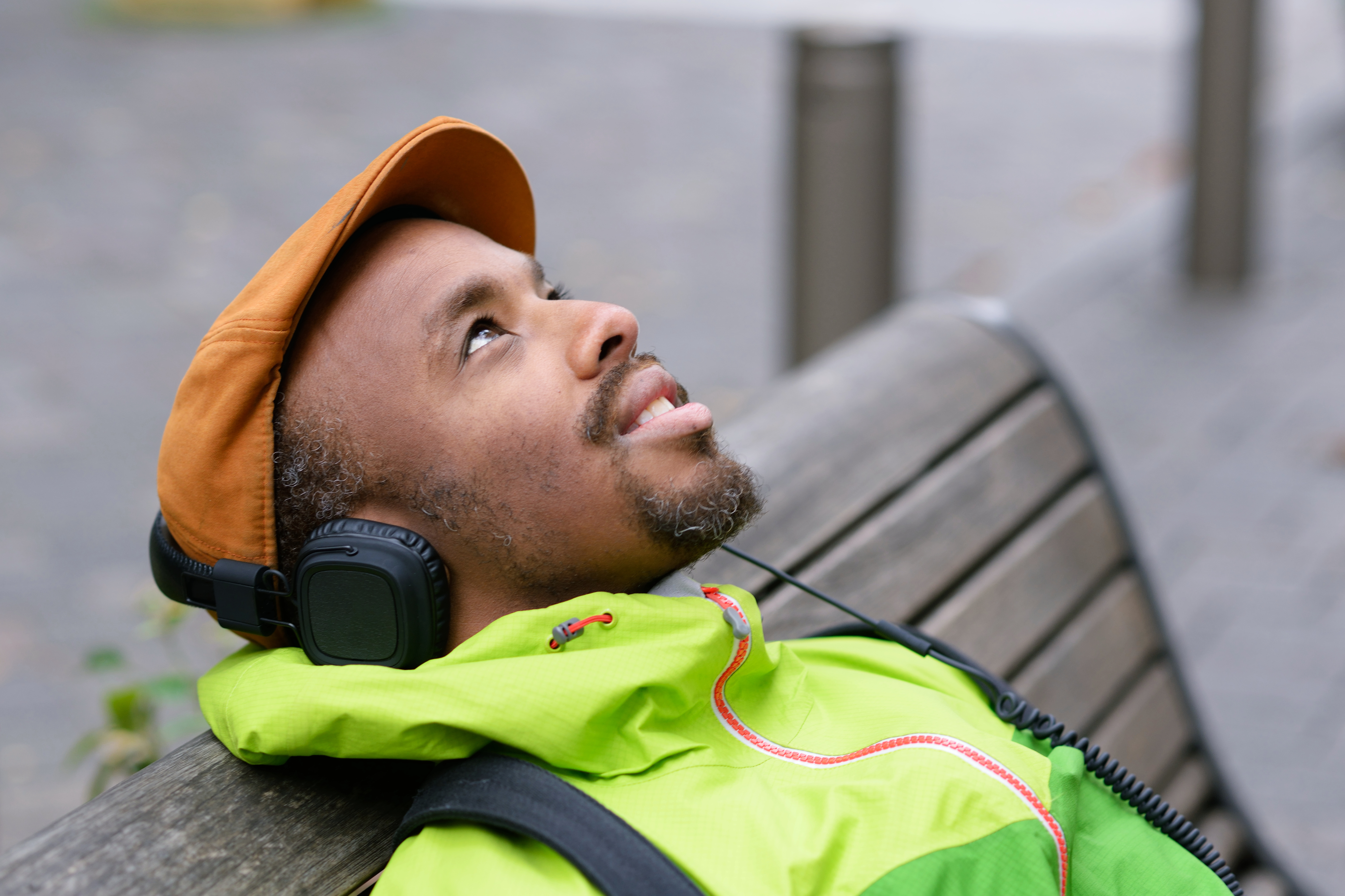 Man sitting outside, listening to music