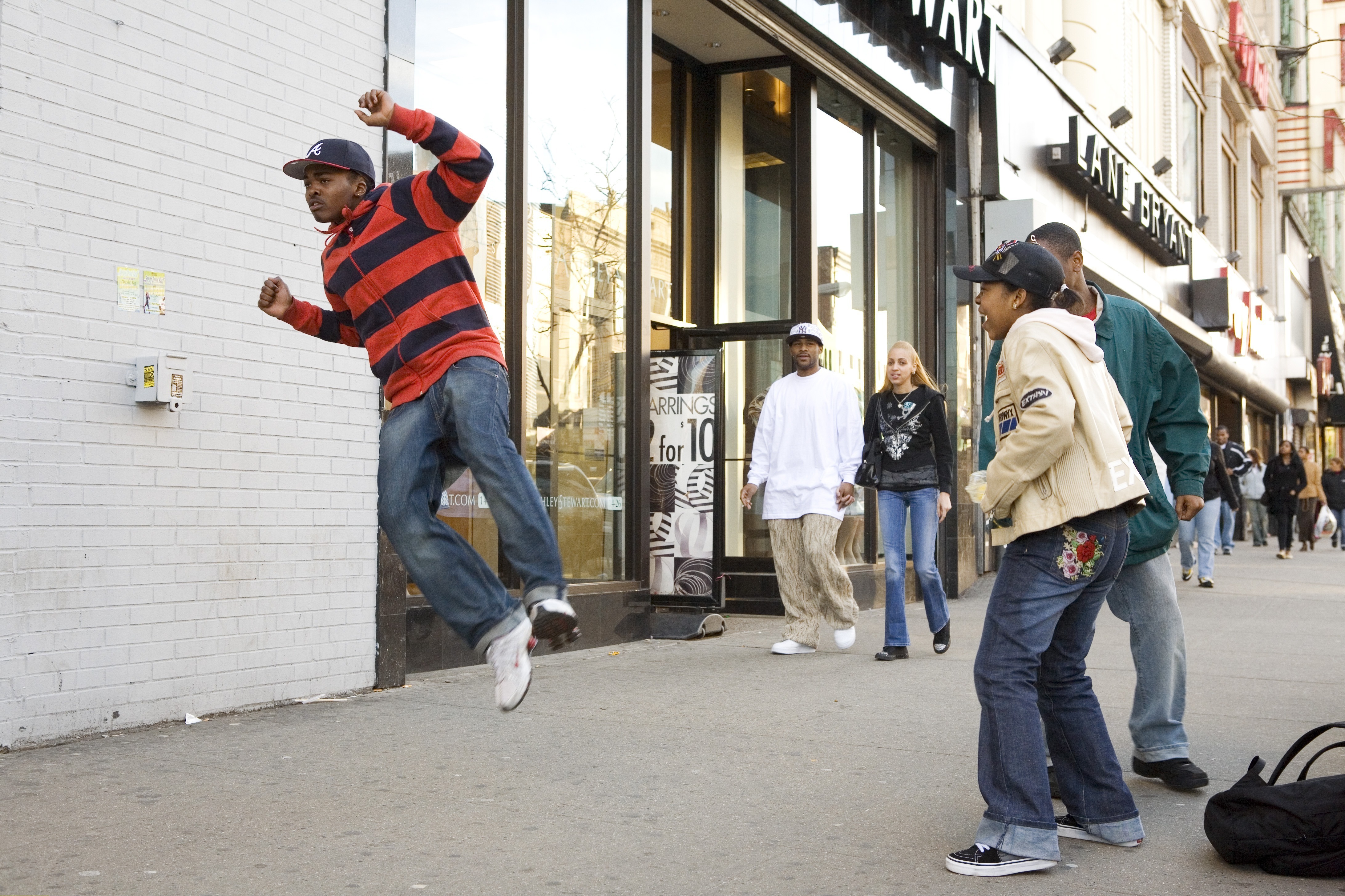 USA - New York City: Harlem, West 125th St.: Youngster dancing on the sidewalk.