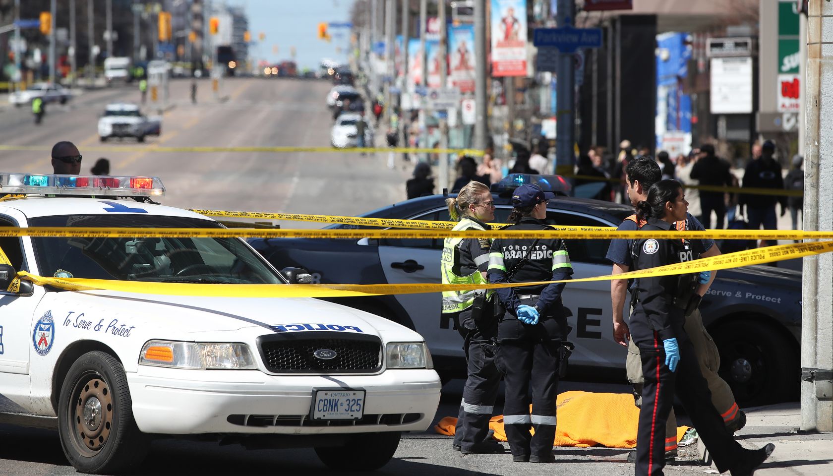 Police investigate a van that ran down pedestrians along Yonge Street between Sheppard and Finch streets in Toronto