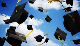 Graduation caps thrown in the air