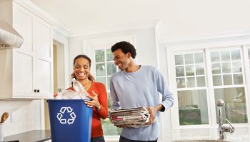 Couple taking out the recycling