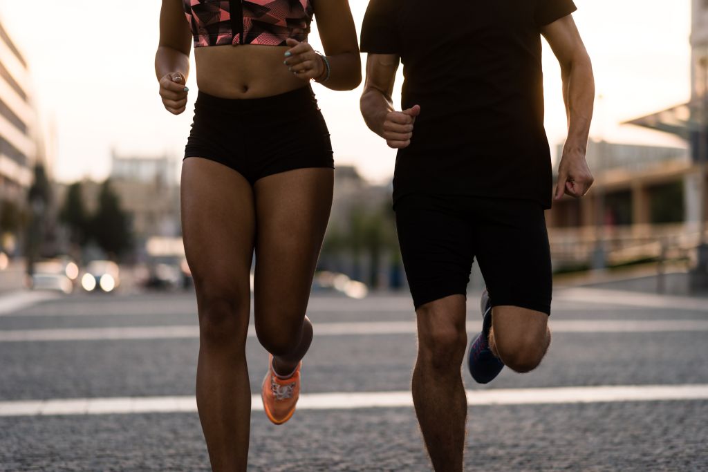 Cropped image of fit jogger couple