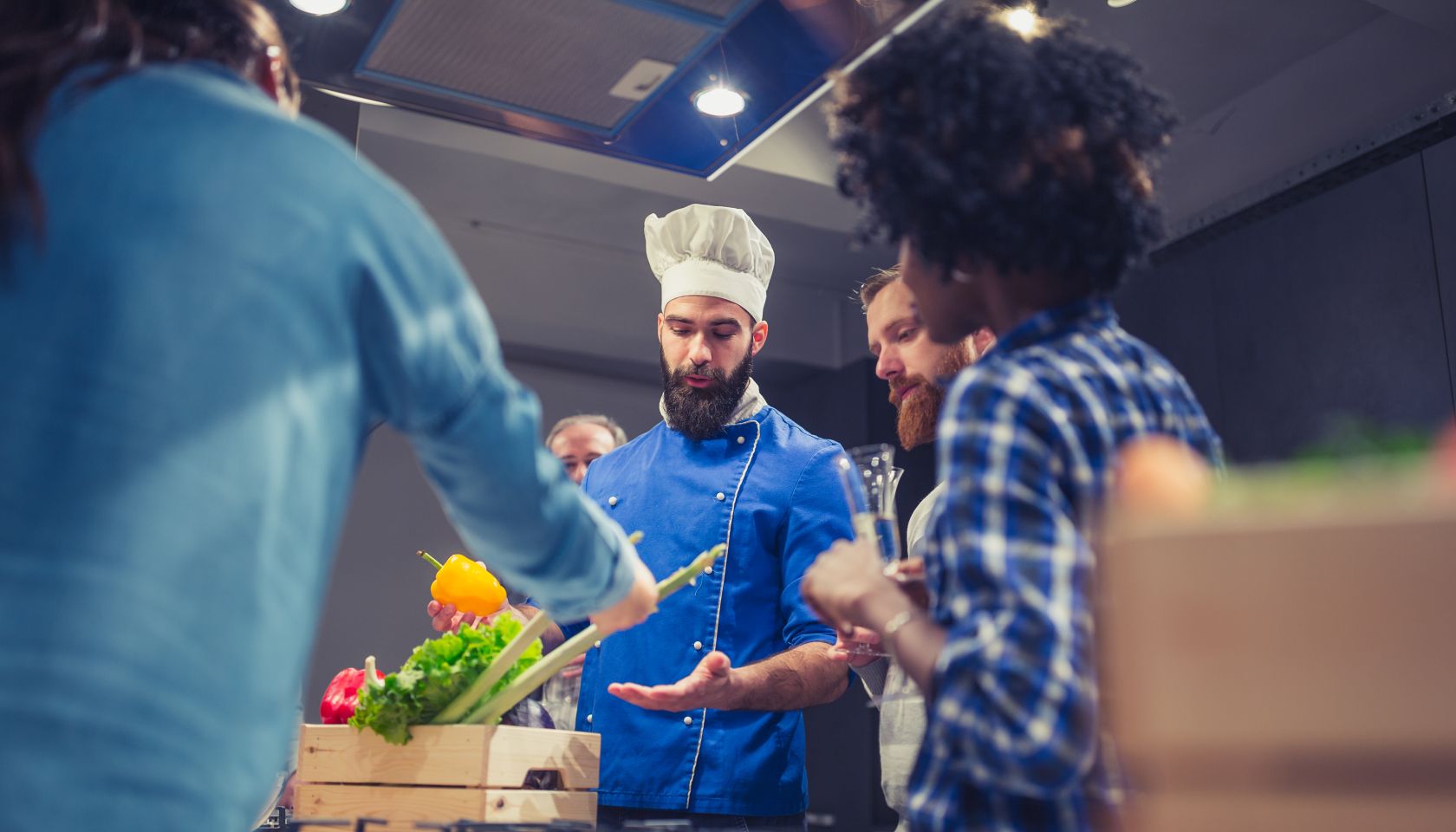 Young chef welcoming his cooking class