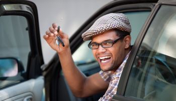 Smiling Man Holding Car Keys