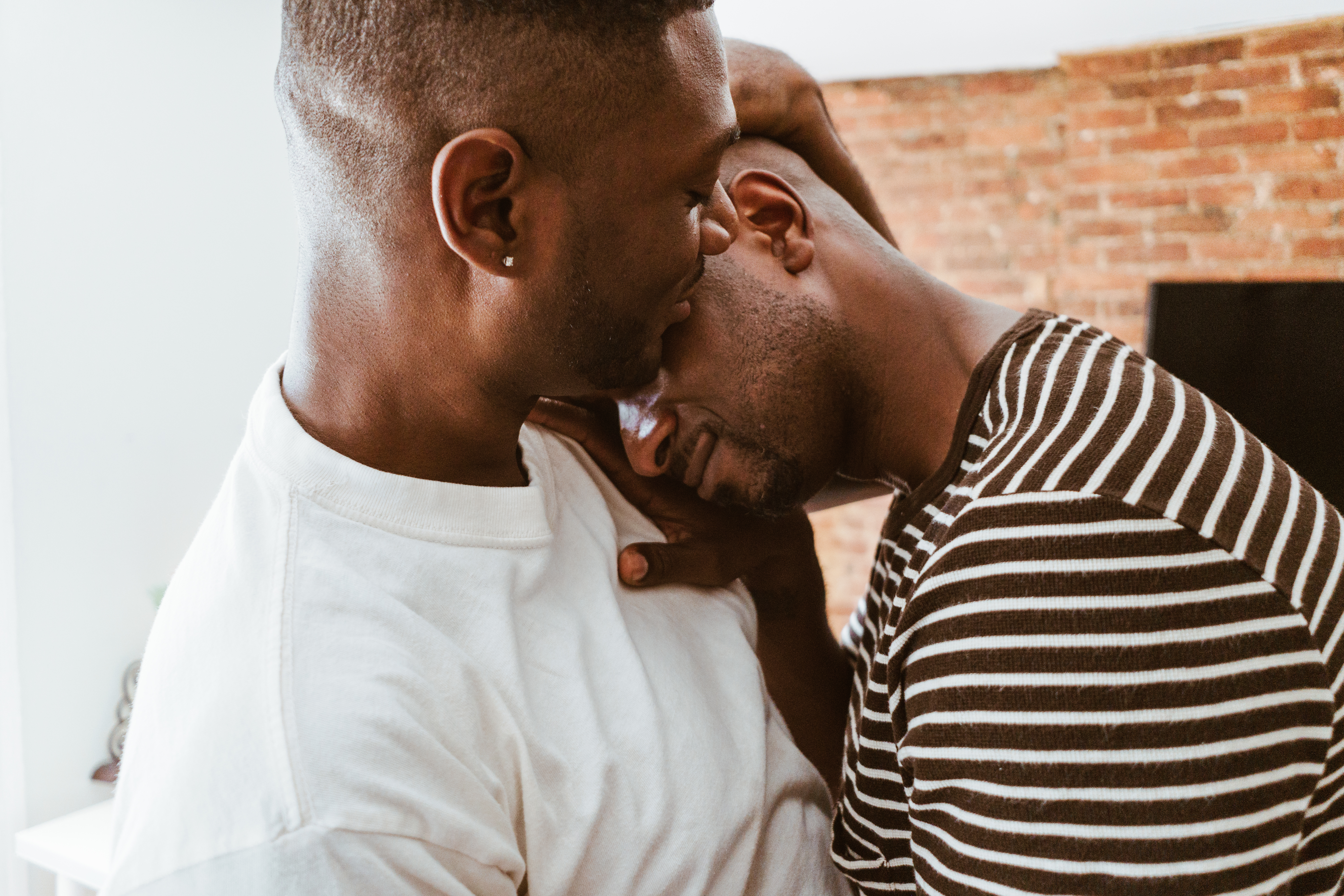 gay couple embracing in the city