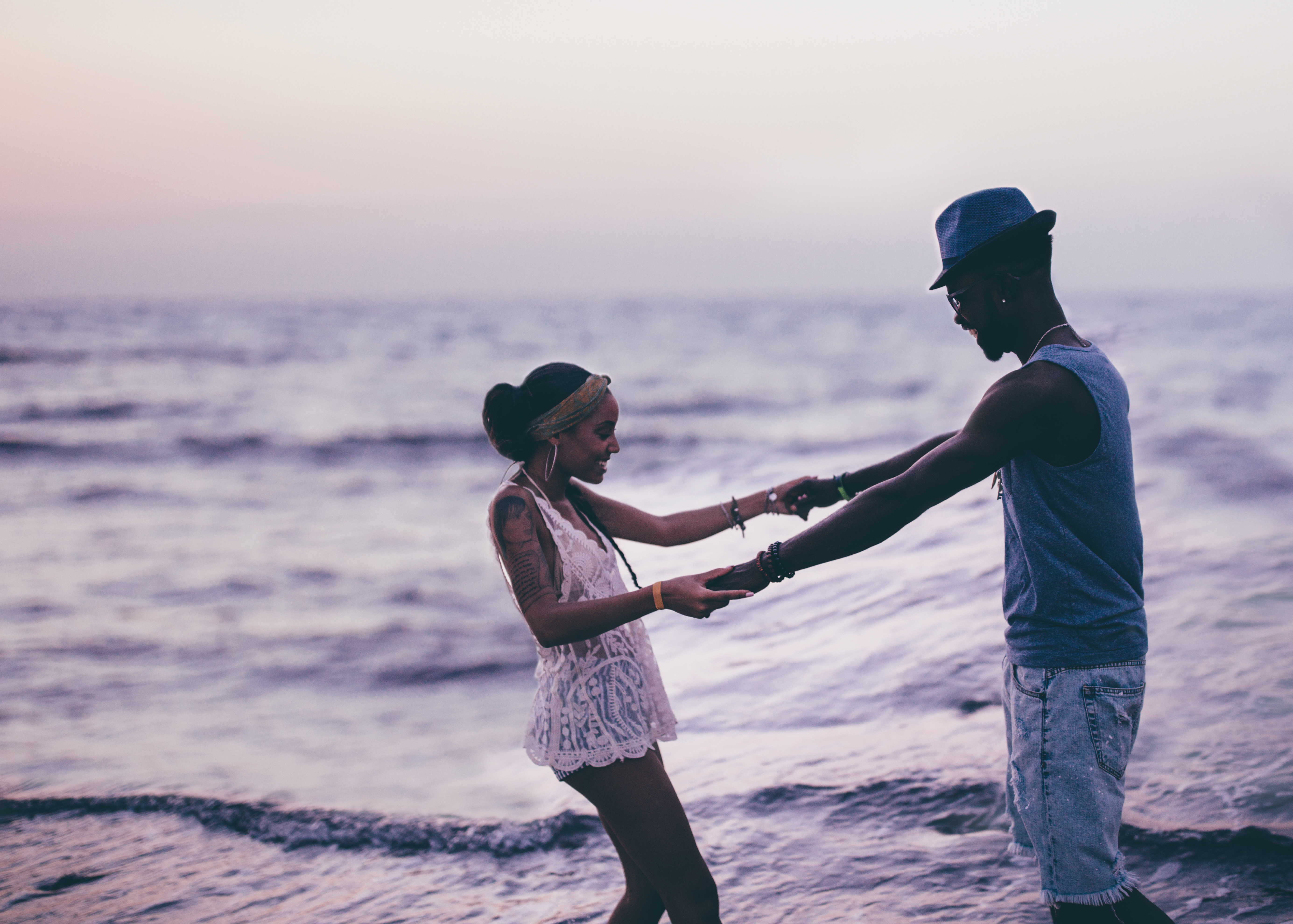 Young couple in love having fun at the beach