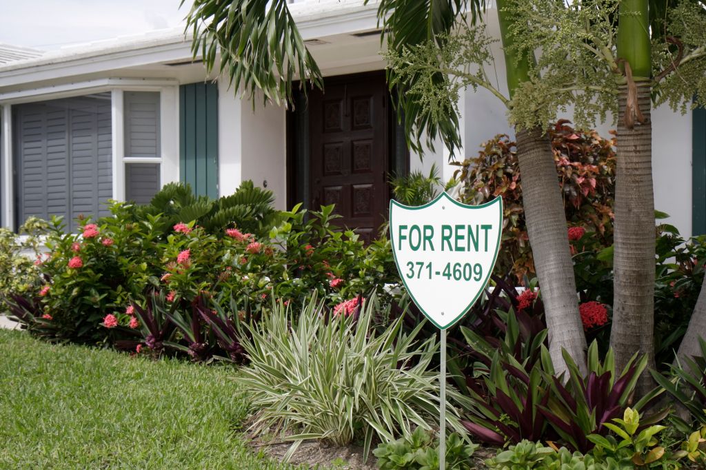 A for rent sign outside a house at Jupiter Inlet Colony.