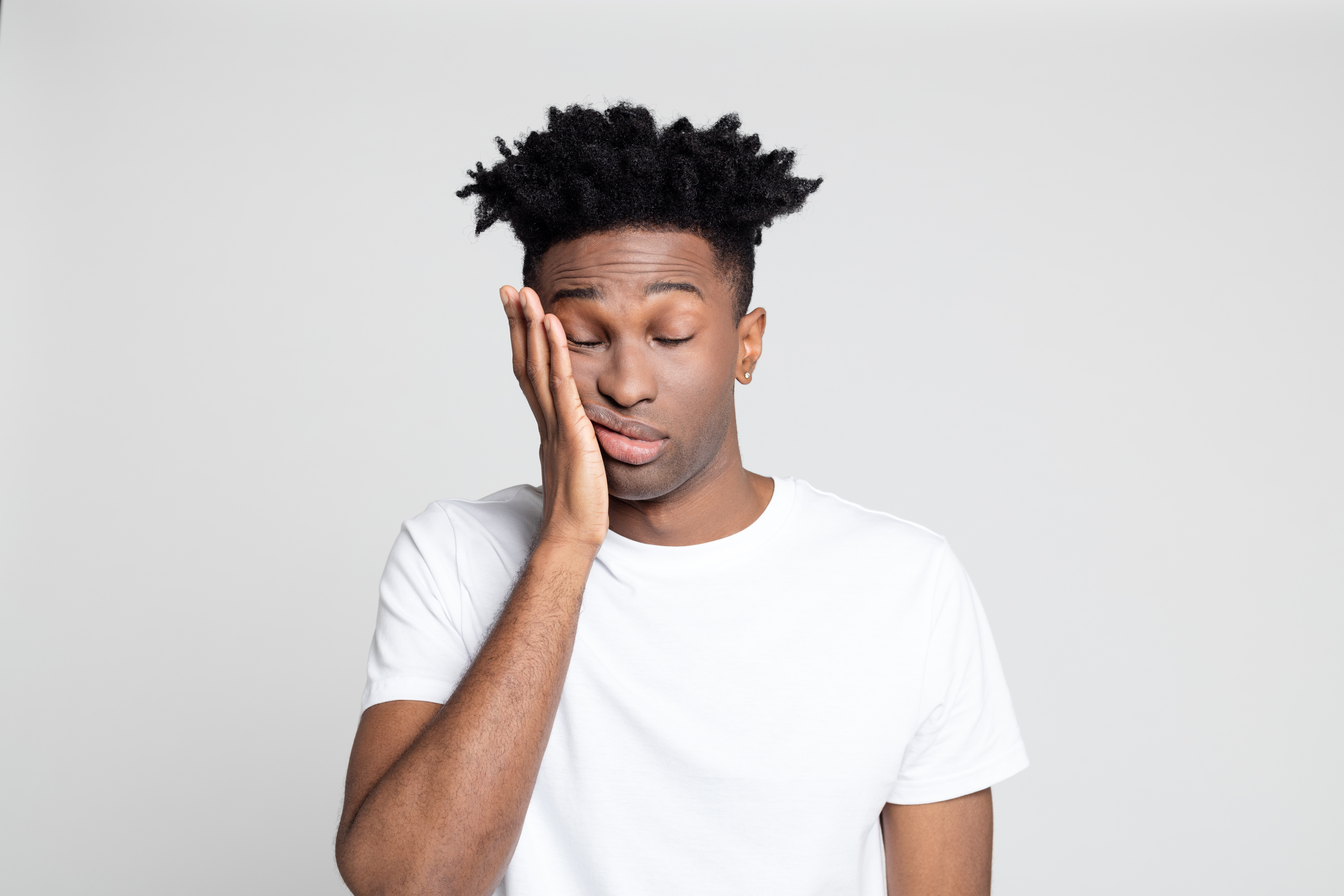 Afro american man with pain in gums
