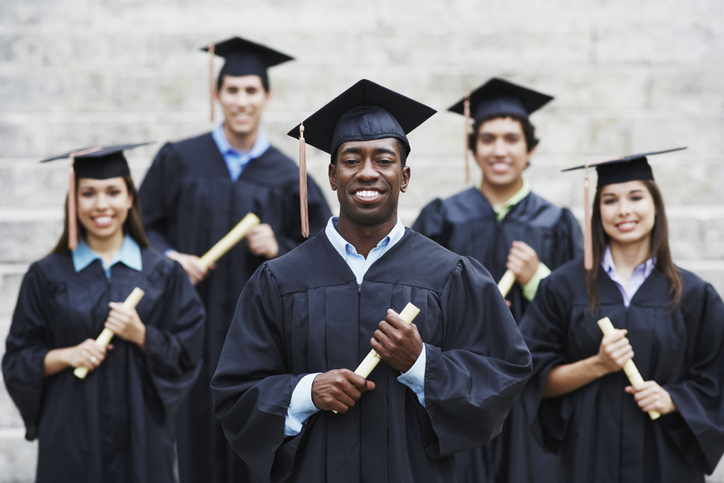 College Graduates Proudly Holding Diplomas
