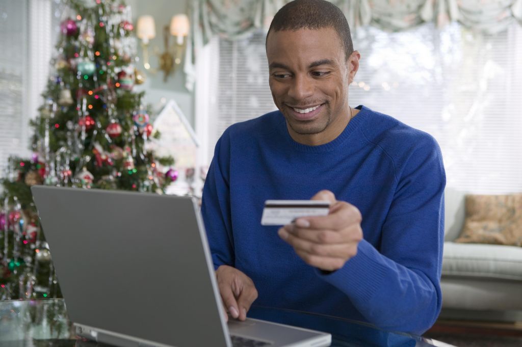 Man with credit card and laptop computer
