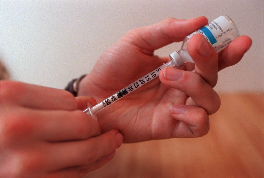 C. J. Renner, who is diabetic. C. J. Renner prepares a shot by mixing two types of insulin (long and short acting).(Photo by JOEY MCLEISTER/Star Tribune via Getty Images)