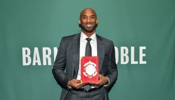 Kobe Bryant Signs Copies Of His Book "Training Camp (The Wizenard Series #1)"