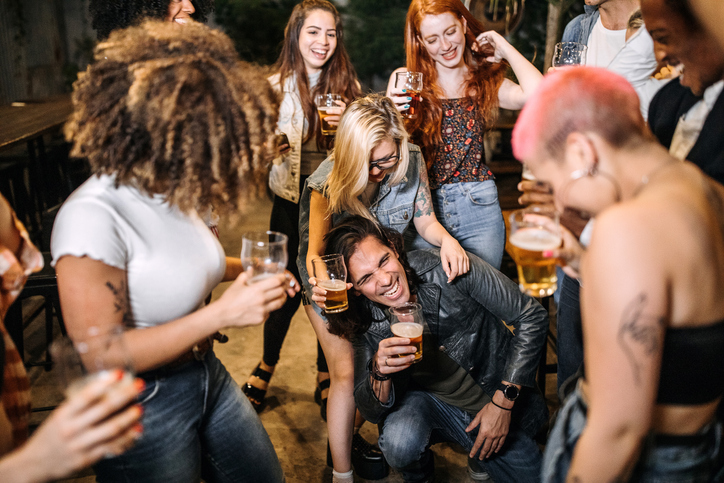 Hipster friends dancing on the party