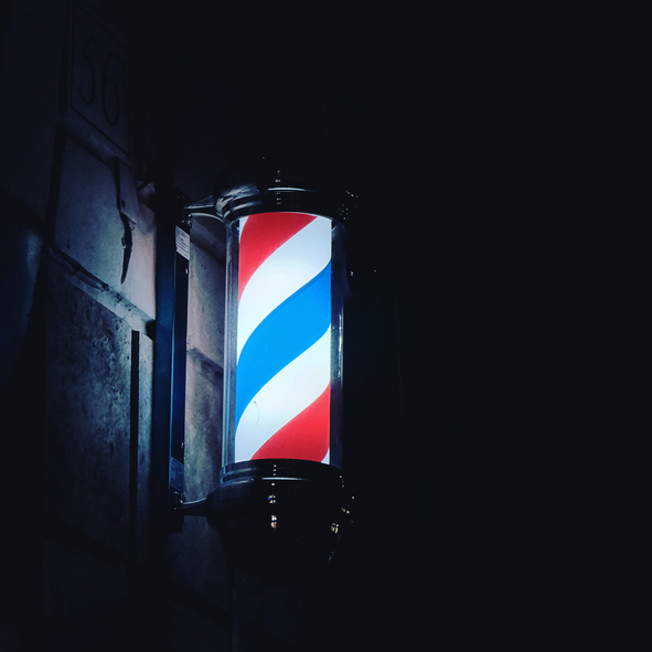 Low Angle View Of Illuminated Sign On Wall