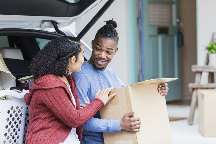 Young African-American couple moving