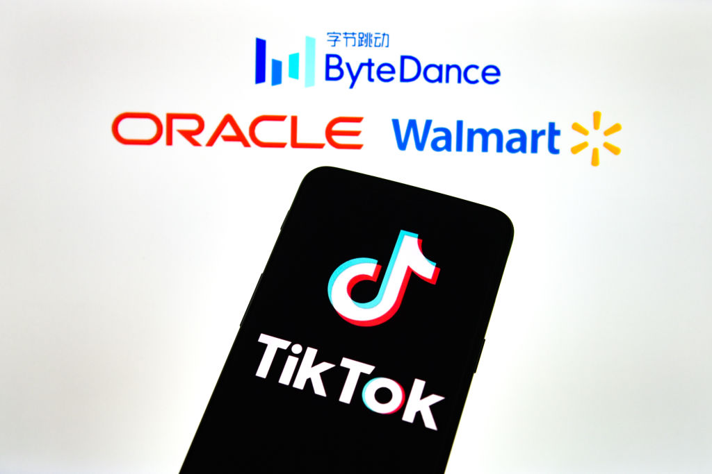 In this photo illustration a TikTok logo is seen displayed...