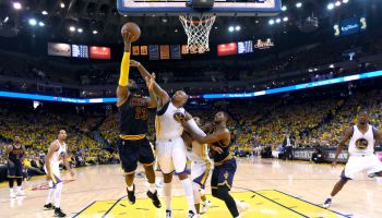 From left, Cleveland Cavaliers' LeBron James (23) tries to make a basket as Golden State Warriors' Marreese Speights (5) blocks and Warriors' Andre Iguodala (9) gets blocked by Cleveland Cavaliers' Tristan Thompson (13) in the second quarter of Game 2 of
