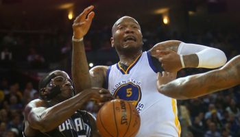Golden State Warriors forward Marreese Speights (5) battles the Orlando Magic's Victor Oladipo (5) for a loose ball during their game on Tuesday, Dec. 2, 2014 in Oakland, Calif. (Aric Crabb/Bay Area News Group)