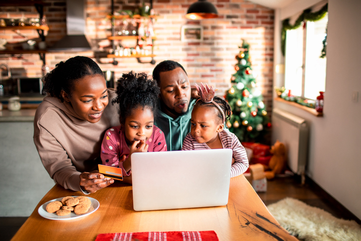 Young family online Christmas shopping