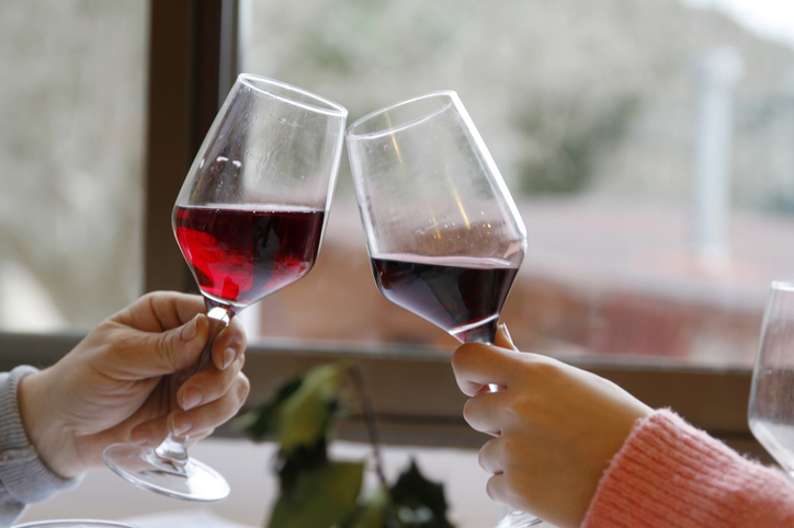 Couple toasting with two wine glasses