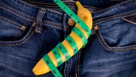 Directly Above Shot Of Banana And Tape Measure On Jeans