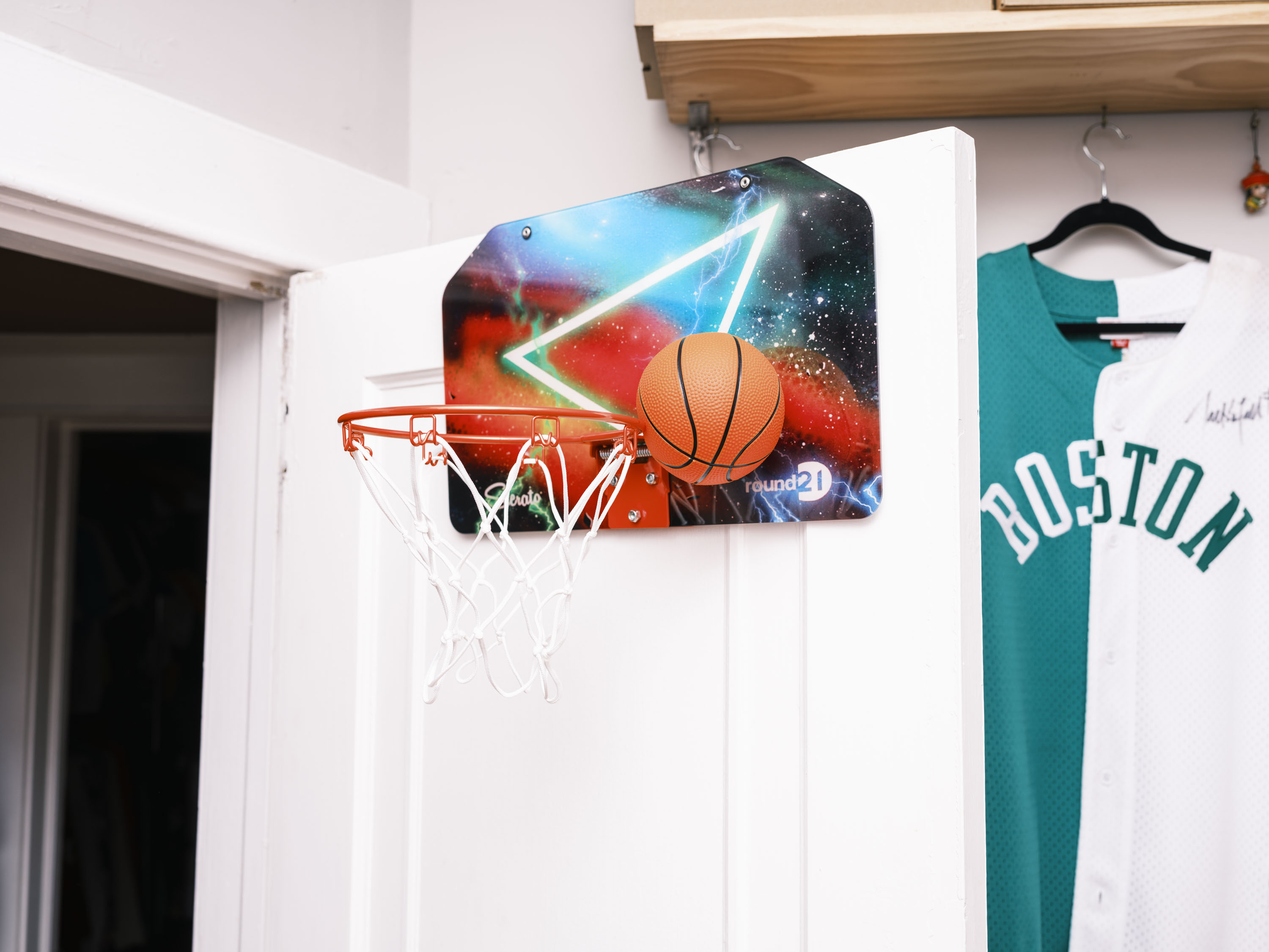 This backboard comes alive through Sierato's classic "galaxy" design. The backboard includes custom work for round21 to symbolize the youthful energy and power that fuels our desire to constantly create and express who we are. 