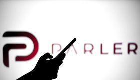 In this photo illustration a Parler logo is seen behind a...