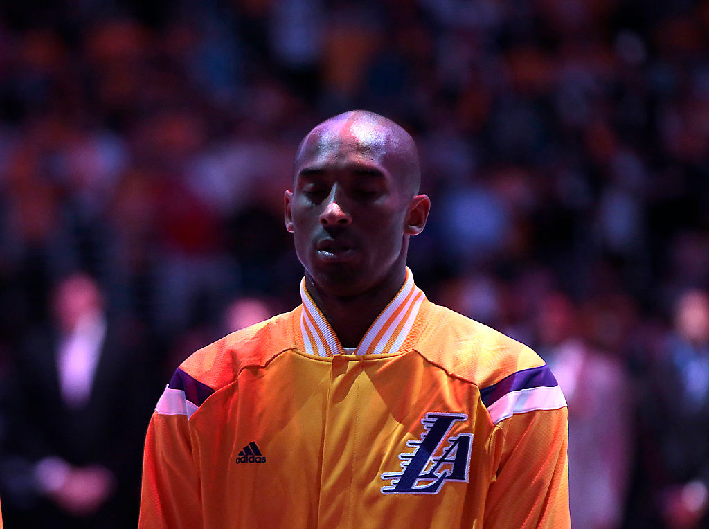 LOS ANGELES, CA, TUESDAY, OCTOBER 28, 2014 - Lakers guard Kobe Bryant listens as the National Anthem